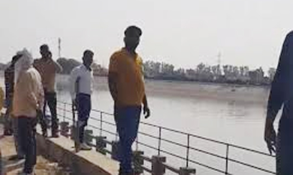 student jumping in river